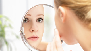young beautiful healthy woman and reflection in the mirror