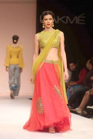 Extraordinary orange and blooming blush net and chiffon based lehenga choli