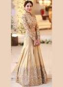 Beige Color Raw Silk Wedding Sangeet Lehenga Choli with Mirror Work at Zikimo