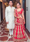 Smashing Red Bridal Lehenga Choli with Velvet Applique Work at Zikimo