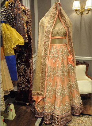 Pleasent Look Peach Lehenga Choli Set with Floral Gold Embroidery At Zikimo