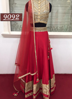 Maroon And Golden Banglori Silk Party Wear Lehenga Choli With Mirror Work at Zikimo