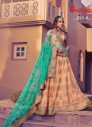 PeachPuff Color Heavy Embroidered Indian Wedding Wear Net Lehenga choli at Zikimo
