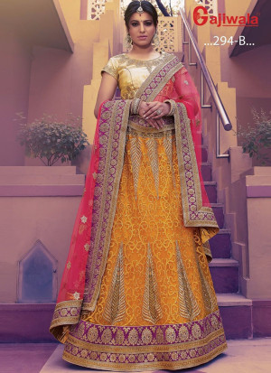 Mustard Heavy Embroidered Indian Wedding Wear Net Lehenga choli With Hot Pink Dupatta at Zikimo