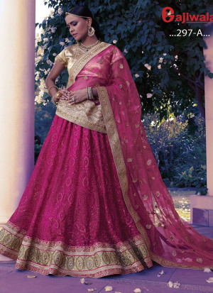 Magenta Heavy Embroidered Indian Wedding Wear Net Lehenga With Golden choli at Zikimo