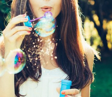 girlblowbubblesStock